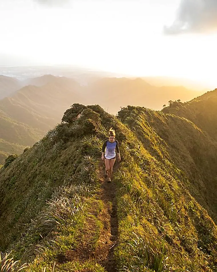 A walker on a high ridge at sunrise