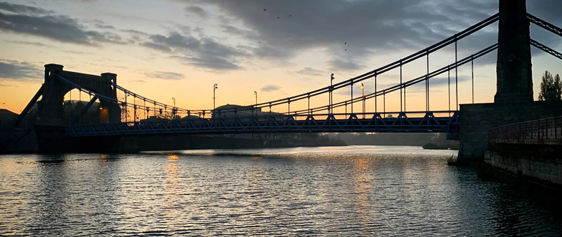 A suspension bridge span at dusk