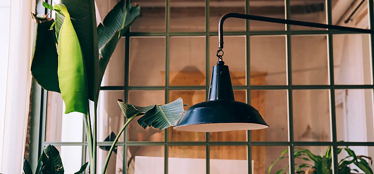 A quiet workspace with a desk lamp at night
