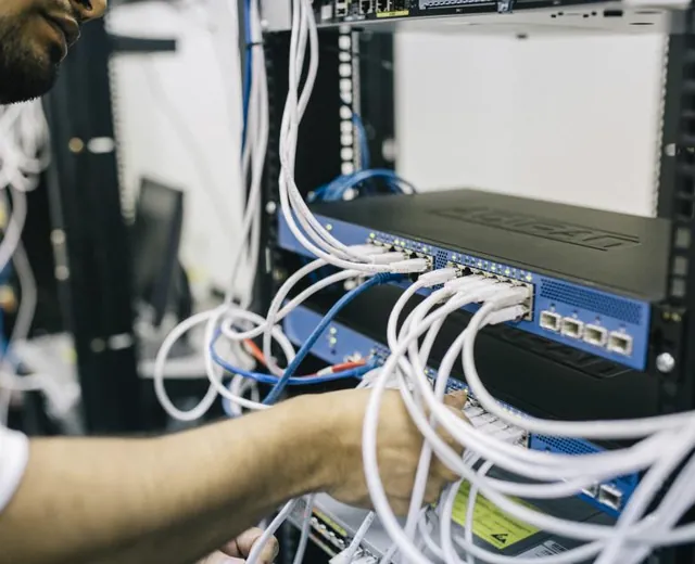 A technician working with structured network cabling
