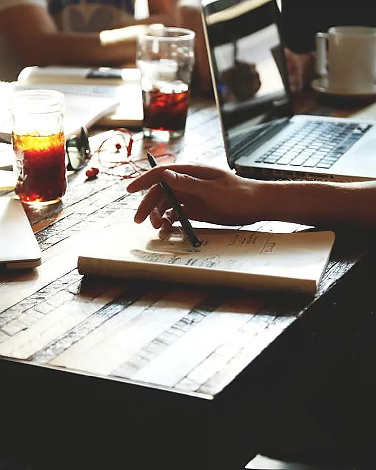 Colleagues collaborating over documents at a table