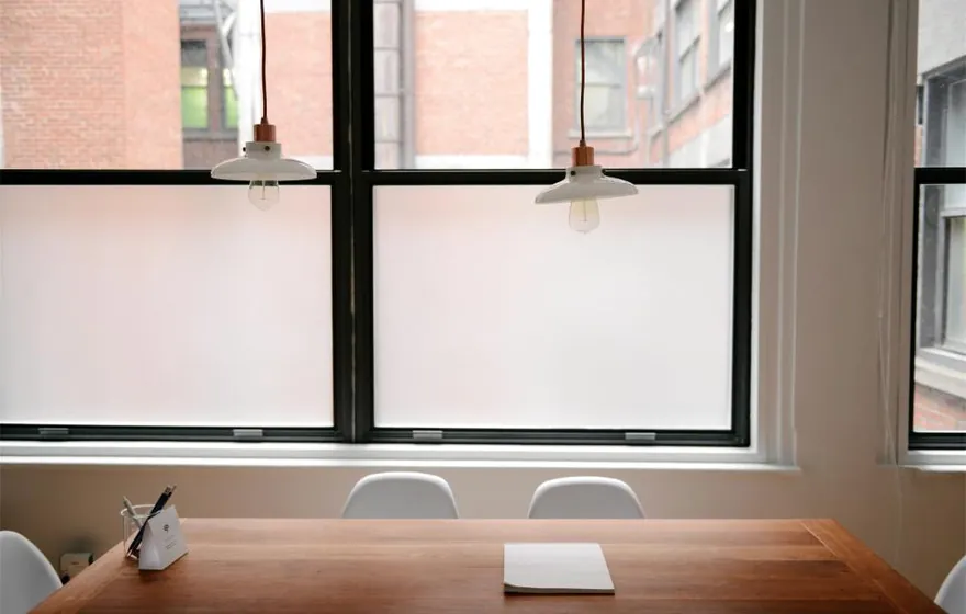 An empty meeting room with morning light through the window